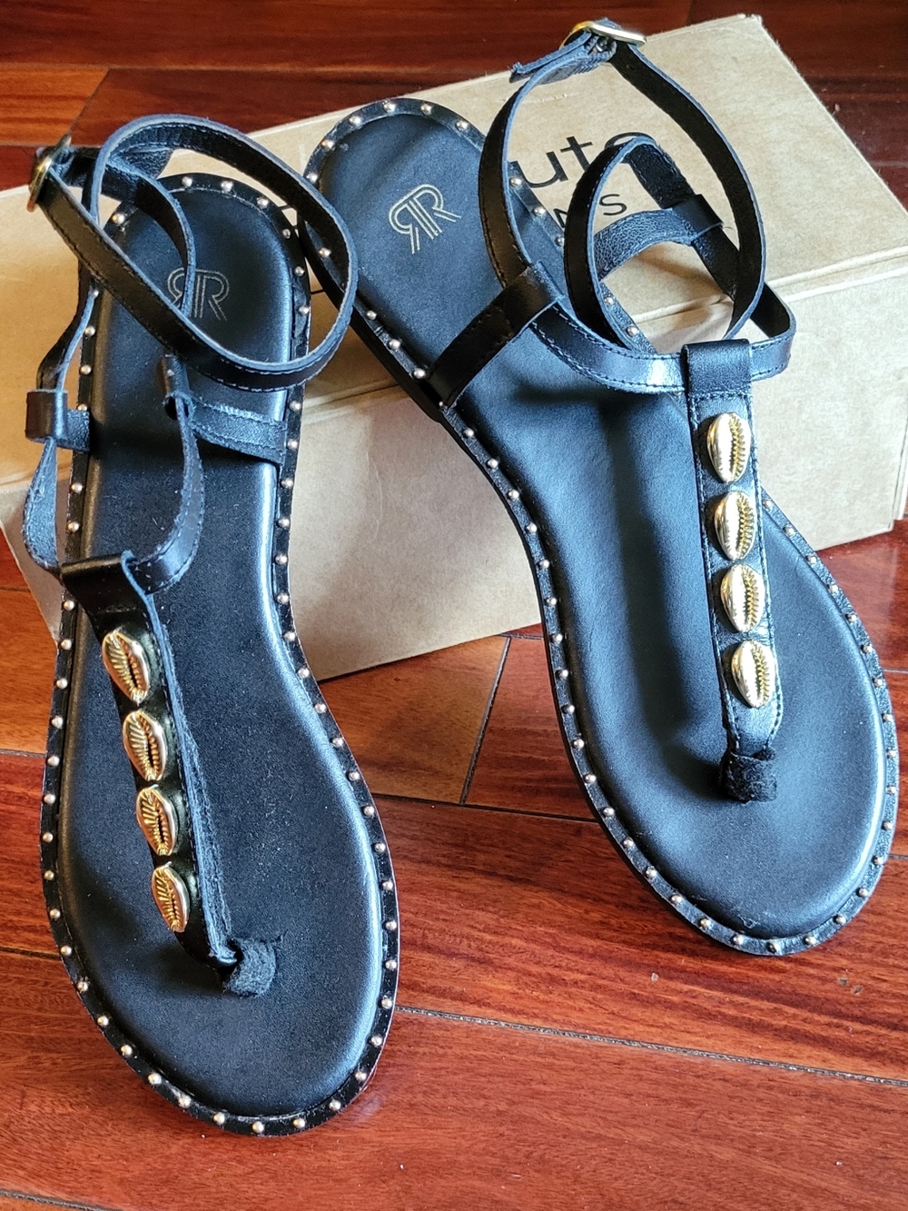Black T-Strap Sandals with Gold Shell Accents by